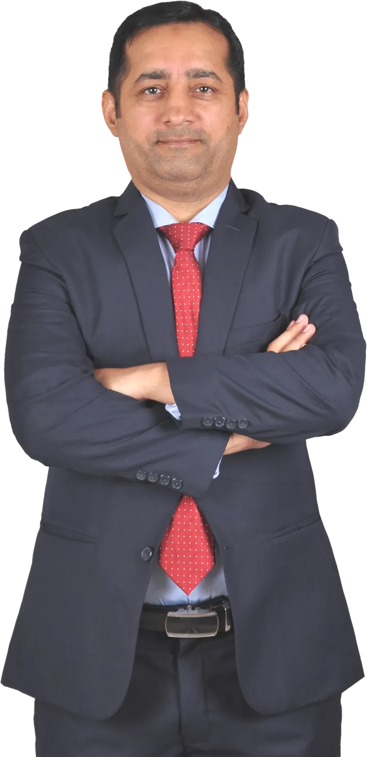 Sajid Khan Ghori in a charcoal suit and red tie, arms crossed